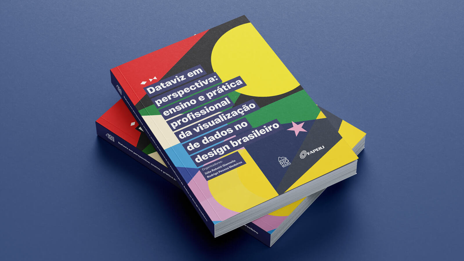 Photo of a pile of two colorful books on a blue background. The book is titled “Dataviz em perspectiva: ensino e prática profissional da visualização de dados no design brasileiro”